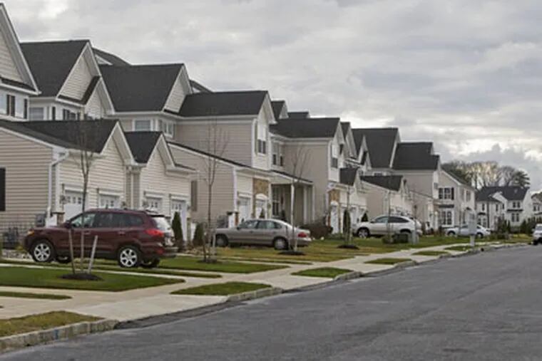 In Mount Laurel , townhouses line Spinnaker Drive at the Rancocas Pointe development. Analysts say the region's shift to townhouses has aided a drop in new-home prices. (David M. Warren / Staff Photographer)