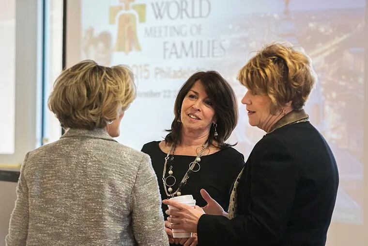 At the event are (from left) Marriane Martelli of the Chester County Chamber of Commerce, Andy Coyle of Visit Philadelphia, and Kathy Baumer of the World Meeting of Families. (ED HILLE/Staff Photographer)