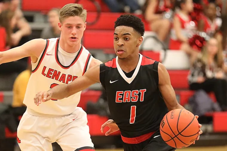 Senior guard Carl Gibson (right) averages 20.6 points for Cherry Hill East.