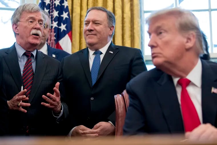 From left, National Security Adviser John Bolton, accompanied by Secretary of State Mike Pompeo, and President Donald Trump.