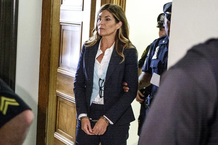 Former state Attorney General Kathleen Kane leaves in handcuffs after her sentencing in 2016.