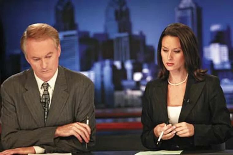Larry Mendte and Alycia Lane at the CBS3 television news desk before Lane was dismissed by the station for off-air incidents. Mendte has now been taken off air. (Jennifer Midberry/Daily News)