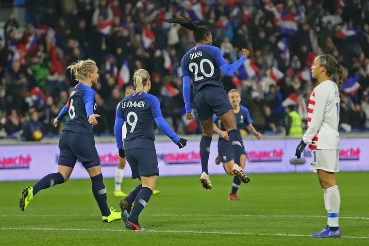 Kadidiatou Diani celebrates scoring one of her two goals in France's 3-1 win over the United States women's national soccer team in Le Havre.