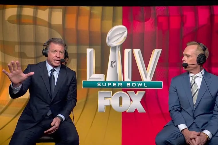 Fox Sports announcers Troy Aikman (left) and Joe Buck in the spacious press box at Hard Rock Stadium in Miami during Super Bowl LIV.