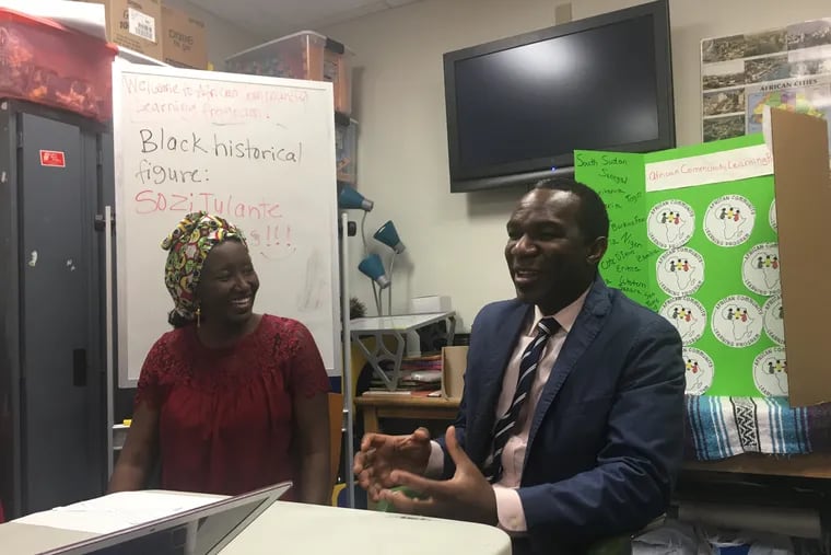 Aminata Sy (left) and Sozi Tulante during his talk in honor of Black History Month at the African Community Learning Program on Wednesday, February 6, 2019 at the Blackwell Library in West Philadelphia.