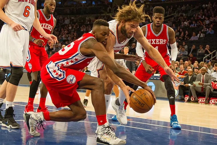 Philadelphia 76ers forward Jerami Grant (39) and New York Knicks center Robin Lopez (8) fight for the ball in the first half at Madison Square Garden.