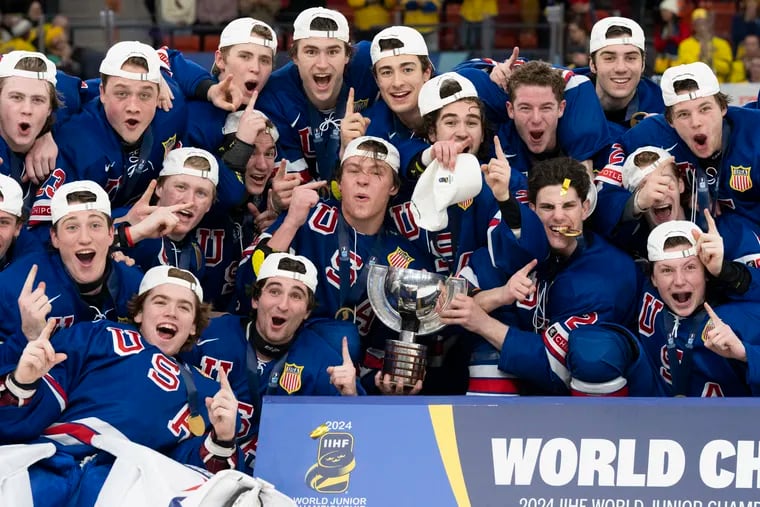 United States players celebrate after winning gold at the World Junior Championships.