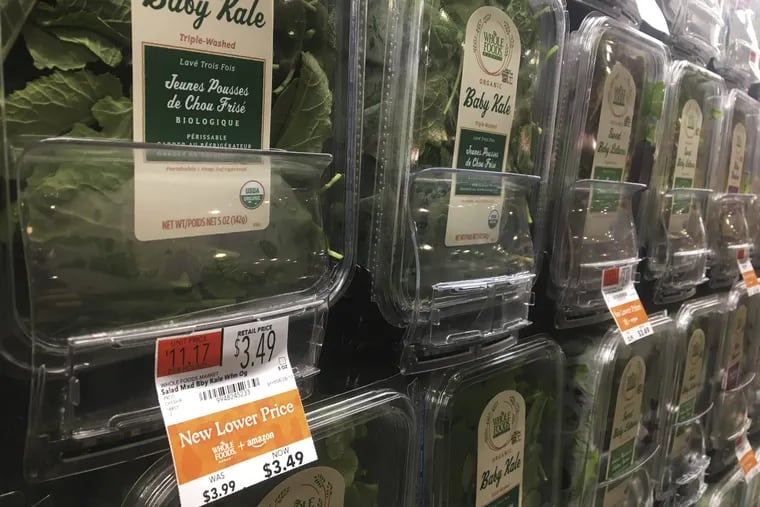 Organic baby kale that has been reduced in price appears on sale at a Whole Foods Market in New York, Monday, Aug. 28, 2017. Amazon has completed its $13.7 billion takeover of organic grocer Whole Foods, and the e-commerce giant is wasting no time putting its stamp on the company. Prices were lowered; Whole Foods brands will soon be on Amazon's site; and Amazon's Prime members could soon get discounts at Whole Foods. The deal could also spur changes in the wider grocery industry.