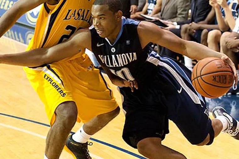 Corey Fisher scored 11 points and dished out eight assists in Villanova's win. (Ed Hille/Staff Photographer)