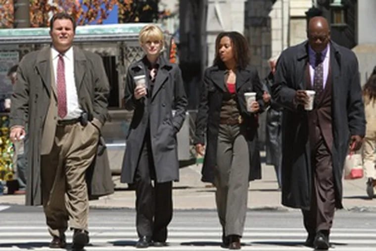 On location in Philadelphia, &quot;Cold Case&quot; cast members (from left) Jeremy Ratchford, Kathryn Morris, Tracie Thoms and Thom Barry rehearse a scene fromthe forthcoming episode titled &quot;Wunderkind.&quot; The cast and crew film here twice a year to capture the city&#0039;s personality and add authenticity to the series.