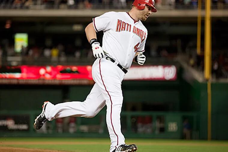 Adam Dunn rounds the bases after hitting a walk-off home run that gave the Nationals a 2-1 win. (Evan Vucci/AP)