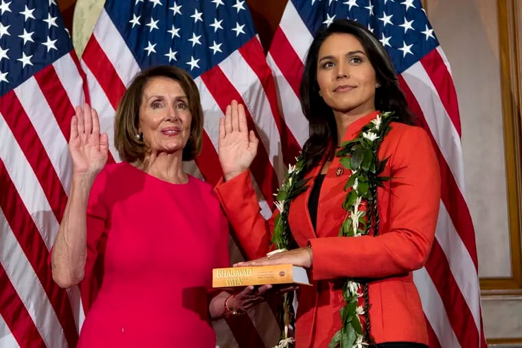 House Speaker Nancy Pelosi of Calif., administers the House oath of office to Rep. Tulsi Gabbard, D-Hawaii, during a ceremonial swearing-in on Capitol Hill in Washington, Thursday, Jan. 3, 2019, during the opening session of the 116th Congress. Gabbard on Thursday responded to criticism about her past work advocating against gay rights by apologizing in a video.