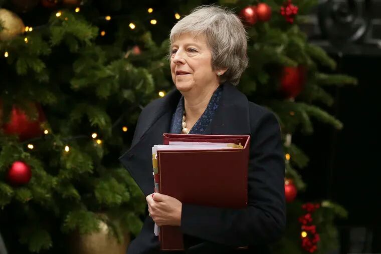 Britain's Prime Minister Theresa May leaves 10 Downing Street to attend the weekly Prime Ministers' Questions session, at parliament in London, Wednesday, Dec. 12, 2018. May has confirmed there will be a vote of confidence in her leadership of the Conservative Party, in Parliament Wednesday evening, with the result expected to be announced soon after. (AP Photo/Tim Ireland)