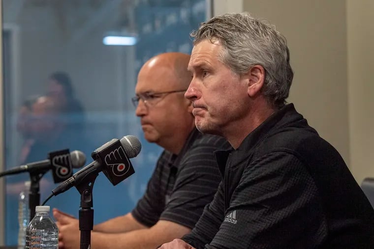 Flyers vice president Brent Flahr (left) and general manager Chuck Fletcher speaking to the media on Wednesday in Voorhees.