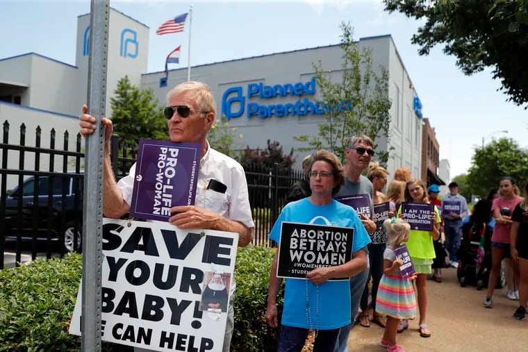 Antiabortion advocates gathered on June 4 outside the Planned Parenthood clinic in St. Louis. A judge is considering whether the clinic, Missouri’s only abortion provider, can remain open. Whether antiabortion activism endangers clinic medical providers is at issue in a lawsuit in Pennsylvania.