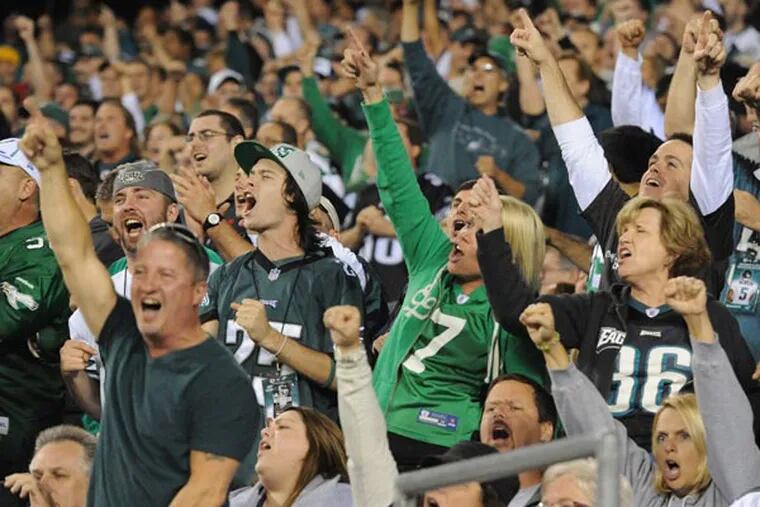 Eagles fans celebrate.Thousands of Eagles playoff tickets flooded Internet ticket exchanges Monday morning, only hours after the team's two-point nail-biter victory over the Dallas Cowboys. (Clem Murray/Staff Photographer)