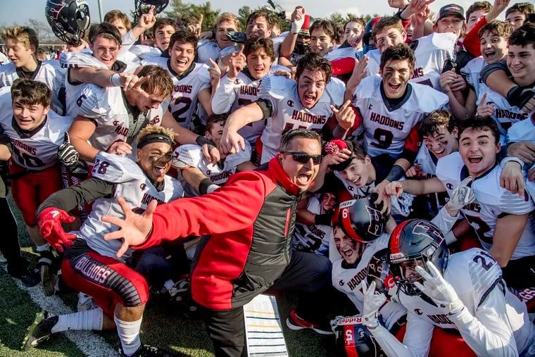 Haddonfield coach Frank DeLano celebrates with his players after last year's victory in the South Jersey Group 2 title game.