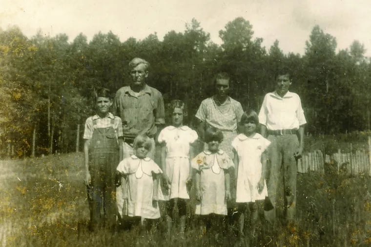 This is the only known photo of Shorty and Della, taken in 1934 (from left): son G.W., father Wrentham Badger “Shorty” Valentine, daughter Maurnice, daughter Willie Fern, daughter Maureen, mother Della Valentine, daughter Juanita and son Eugene.