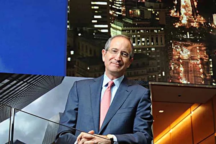 Brian Roberts, chairman and CEO of Comcast Corporation, photographed Oct. 30, 2013 in the lobby of the Comcast Building in Center City Philadelphia in front of the huge video wall which is showing scenes of Philadelphia.  Comcast commemorates its 50th anniversary in November.  ( CLEM MURRAY / Staff Photographer )