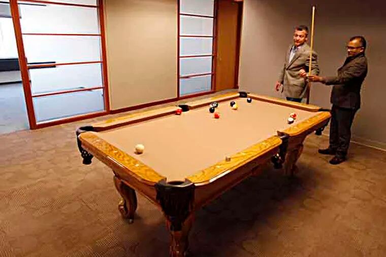 Christopher Doggett (left) and Christopher Gali (right) play some pool in Adminovate, a company they started to create insurance administrative software. ( MICHAEL S. WIRTZ / STAFF PHOTOGRAPHER ). May 1, 2013.