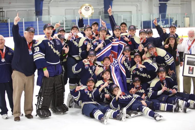 The West Chester Rustin ice hockey team celebrates after winning its first national championship in 2017.