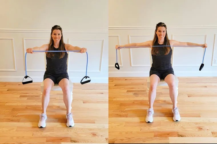 Ashley demonstrates chest extensions with a resistance band.