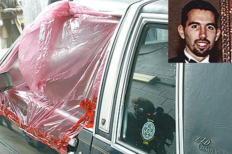 The car of slaying victim John Gilbride (inset), who was shot through the driver's side window in September 2002. (File photo)