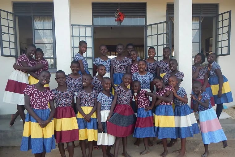 For many of the Ugandan girls pictured here, these colorful outfits made by University of Minnesota design students are the first new pieces of clothing they’ve owned.