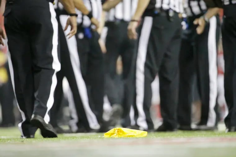A penalty flag lies on the turf during the second half of an NFL preseason football game between the Atlanta Falcons and the Tennessee Titans,