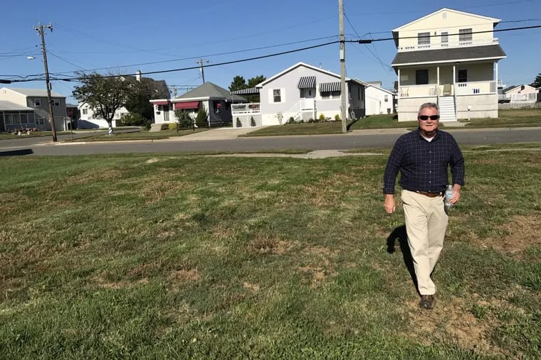 Five years on, 1,300 Hurricane Sandy survivors are still not back in their homes. Here, Tom Flounders walks the empty North Wildwood lot where his home used to be.