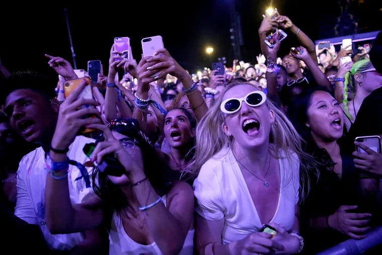 Fans watch as Cardi B performs during the first day of the Made in America Festival on the Benjamin Franklin Parkway in Philadelphia on Saturday, Aug. 31, 2019.
