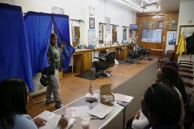 Phyllis Wade exits a voting booth after casting her 2018 ballot at Philly's Finest Unisex Salon in West Philadelphia. In 2019, Philadelphia voters will consider three ballot questions.