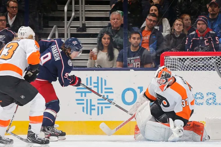 The Columbus Blue Jackets' Artemi Panarin (9) scores a goal past Philadelphia Flyers goaltender Brian Elliott (37) during the second period at Nationwide Arena in Columbus, Ohio, on Thursday, Feb. 28, 2019. (Adam Cairns/Columbus Dispatch/TNS)