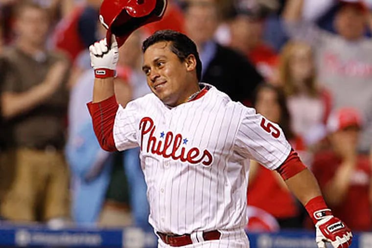 Carlos Ruiz tosses his helmet as he heads towards home plate after his walkoff home run. (Ron Cortes/Staff Photographer)