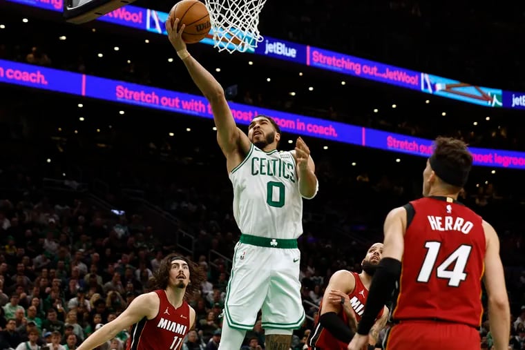Jayson Tatum #0 of the Boston Celtics goes to the basket as the Miami Heat defense looks on during the second half of game one of the Eastern Conference First Round Playoffs at TD Garden on April 21, 2024 in Boston, Massachusetts.