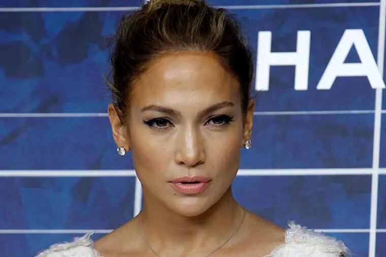 FILE - In this Oct. 2, 2012 file photo, Jennifer Lopez arrives for the presentation of Chanel's ready-to-wear Spring-Summer 2013 collection in Paris.  (AP Photo/Thibault Camus, File)