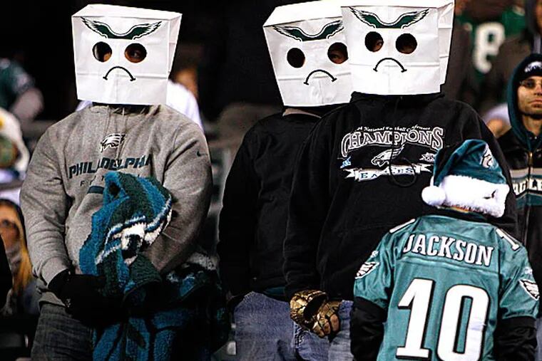Eagles' fans bag their heads during a loss. (David Maialetti/Staff Photographer)