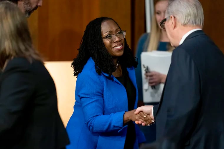 Supreme Court nominee Ketanji Brown Jackson shakes hands with Chairman Sen. Dick Durbin, D-Ill., right, as she departs following her Senate Judiciary Committee confirmation hearing on Capitol Hill in Washington, Wednesday, March 23, 2022.