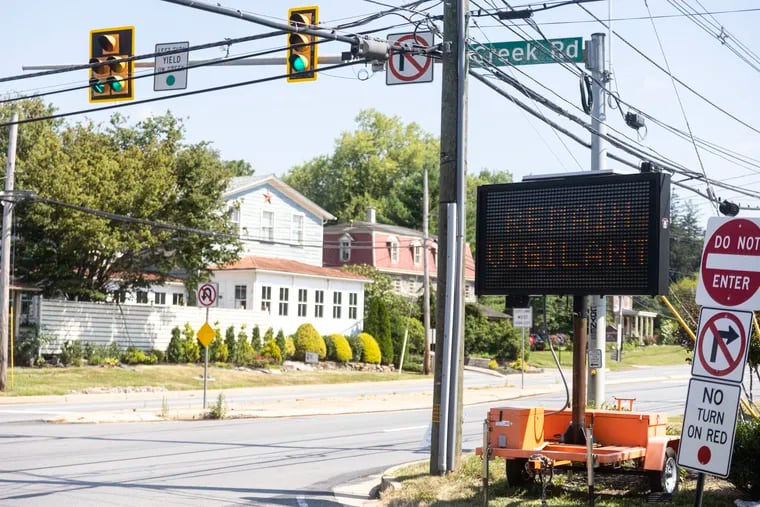 Traffic signs warned residents and drivers passing through Chadds Ford on Wednesday to remain vigilant as the manhunt continues for escaped murderer Danelo Cavalcante.