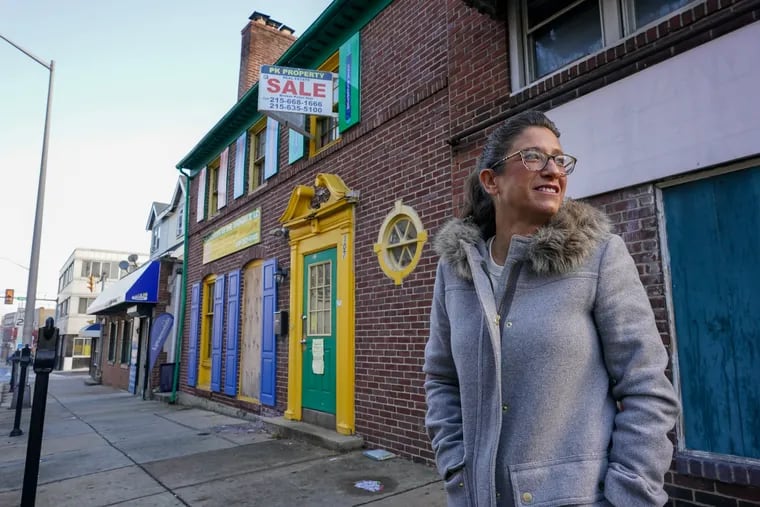 Stephanie Sena stands in front of the building that will house a homeless shelter she is creating in Upper Darby.