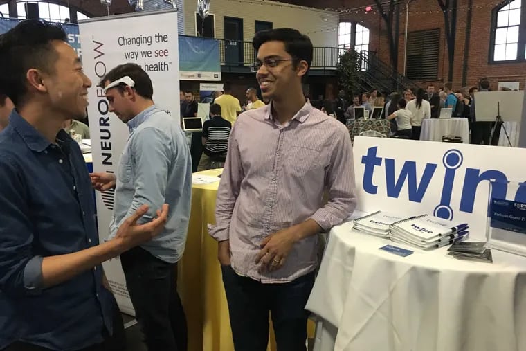 Joseph Quan (left) and Nikhil Srivastava took first place in the Penn Wharton Startup Showcase with Twine, their algorithmic solution for keeping employees engaged by moving them into more fulfilling new jobs.