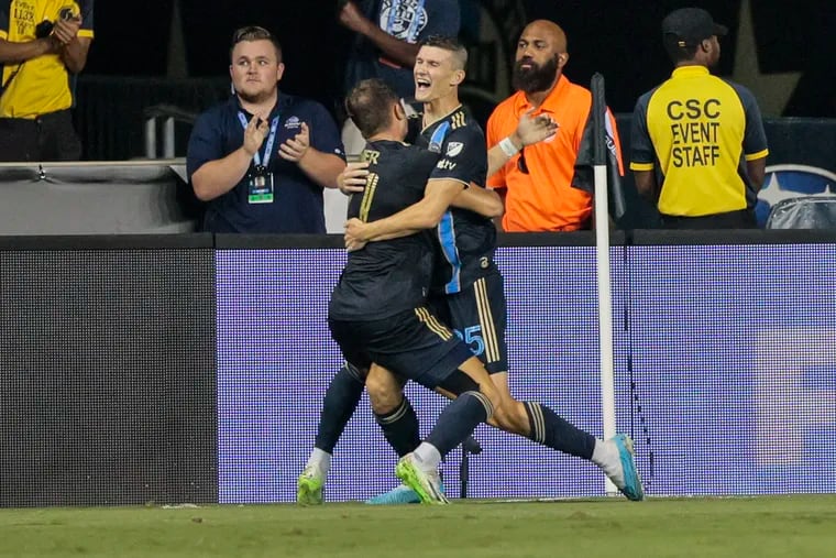 Chris Donovan (right) celebrates his game-winning goal against Querétaro with teammate Alejandro Bedoya in the Leagues Cup quarterfinals match Friday at Subaru Park.