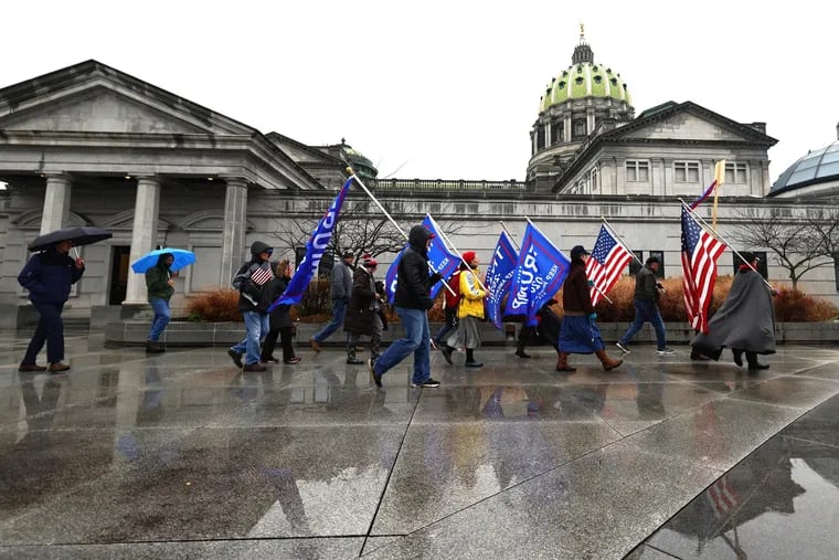 Supporters of then- President Donald Trump gather outside the Pennsylvania State Capitol in Harrisburg last December.