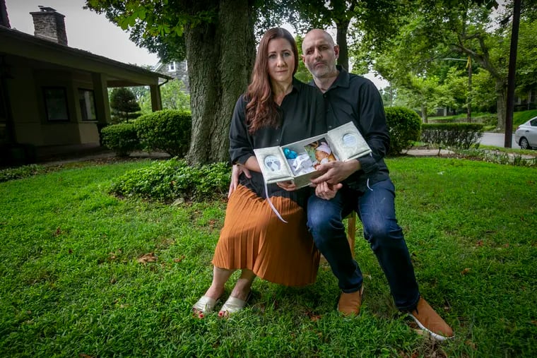 Julia and Eugene Gross, shown outside their home in Elkins Park, have been trying for more than a year to find out where exactly their stillborn son, Noach, was buried. His heart stopped beating when she was 35 weeks pregnant.