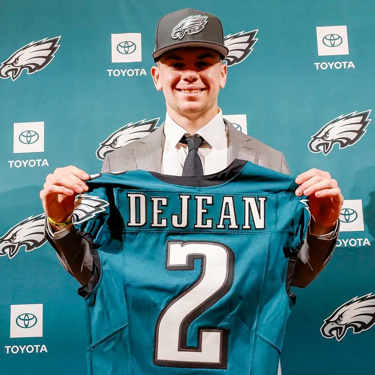 Second-round pick Cooper DeJean holds his jersey after meeting with the media at the NovaCare Complex on Saturday,