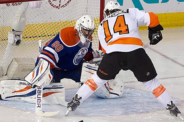 The Flyers' Sean Couturier is stopped by Oilers goalie Ilya Bryzgalov. (Jason Franson/The Canadian Press/AP)