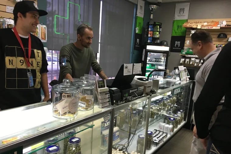 NJ Senator Nick Scutari examines the .cannabis products, including Sweet Grass cookies at a dispensary in Denver the first time he took a contingent of lawmakers to see legalization firsthand.