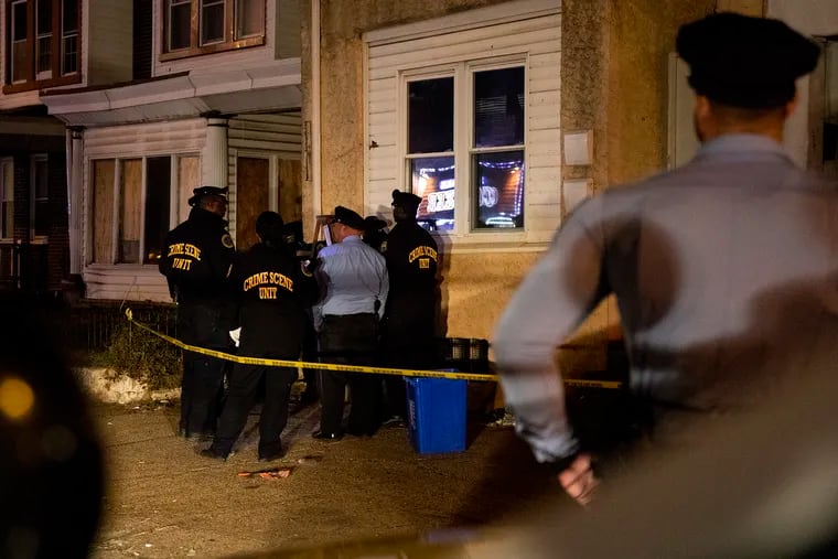 Philadelphia police investigate a bullet hole in a home after left a 10-year-old boy critically wounded on Wednesday, Nov. 6, 2019.