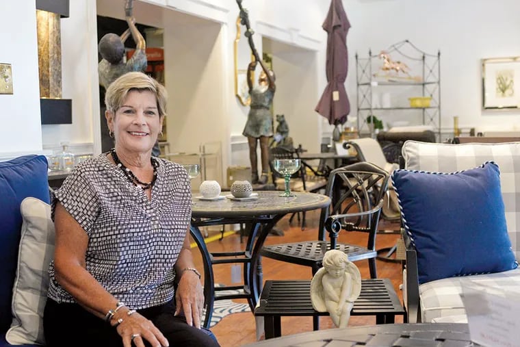 Linda Moran owns Hill Co. in Chestnut Hill, an outdoor furnishing supplier that she moved from the top of Germantown Avenue to the bottom for almost three times the space. (BEN MIKESELL/Staff Photographer)