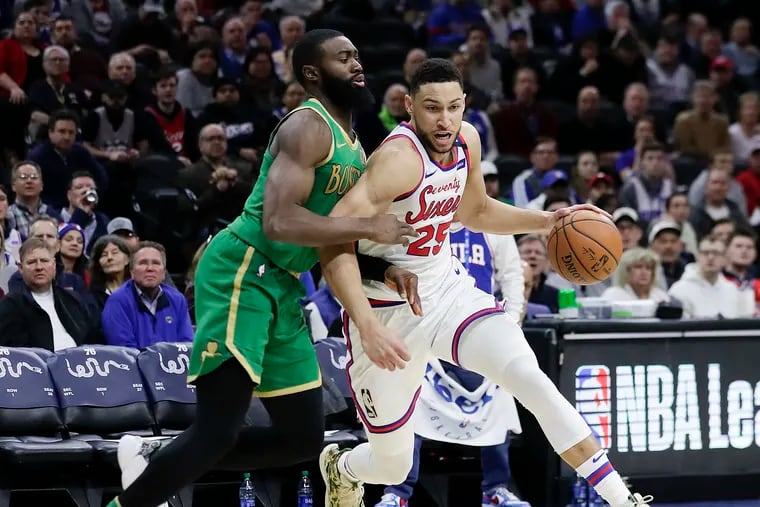 Sixers guard Ben Simmons dribbles past Boston Celtics guard Jaylen Brown during a game on Jan. 9 at the Wells Fargo Center.
